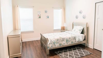 Cozy bedroom with floral bedding and natural light