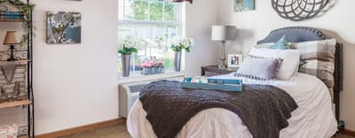 Cozy bedroom with floral decor and natural light