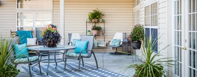Patio area with outdoor seating and greenery