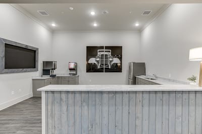 Interior view of a facility common area with kitchen appliances