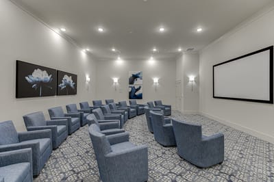 Interior view of a comfortable movie room with seating