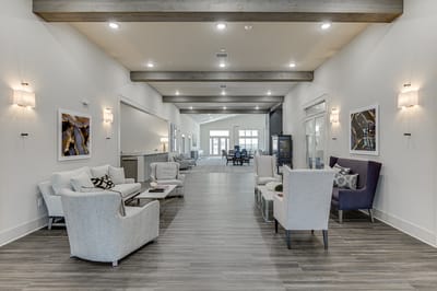 Bright interior common area with seating and decor