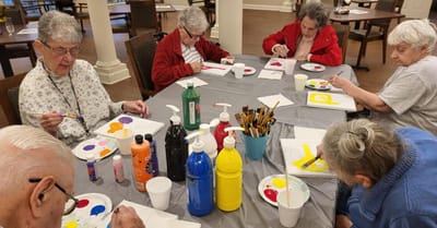 Residents engaging in a painting activity