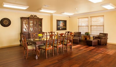 Bright dining room with a large table and chairs