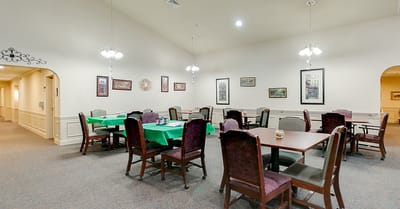 Dining area with tables set for residents