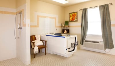 Clean and spacious bathroom for residents with a walk-in tub