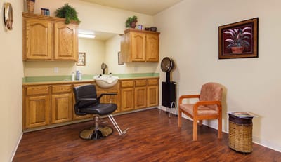 Hair salon space with a styling chair and salon equipment