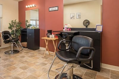 Hair salon area with salon chairs and mirrors