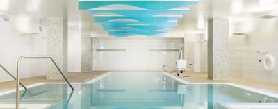 Indoor swimming pool area with modern decor