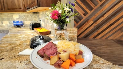Plate of food with vegetables on a table