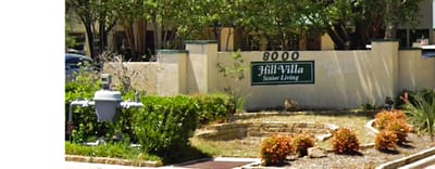 Exterior view of Hill Villa Senior Living entrance sign