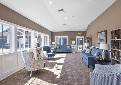 Bright common area with seating and natural light