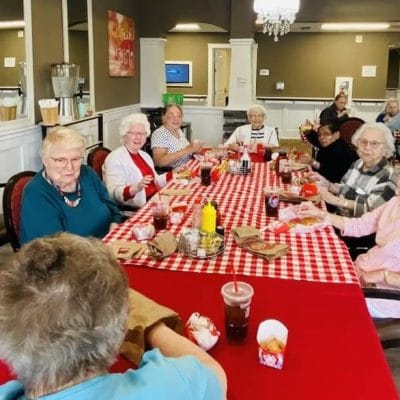 Residents enjoying a meal together in the dining room