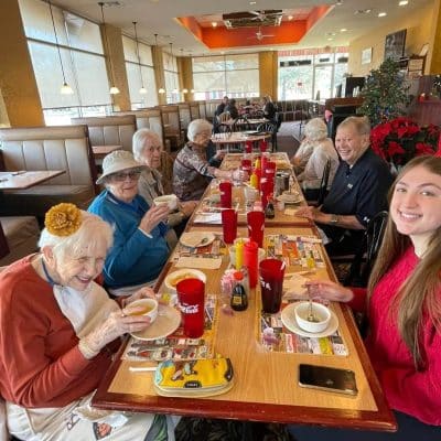 Residents enjoying a meal together at a dining area