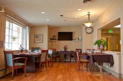 Dining area with tables and chairs for residents