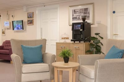 Common area with seating and a coffee machine