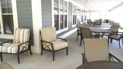 Outdoor seating area with tables and chairs