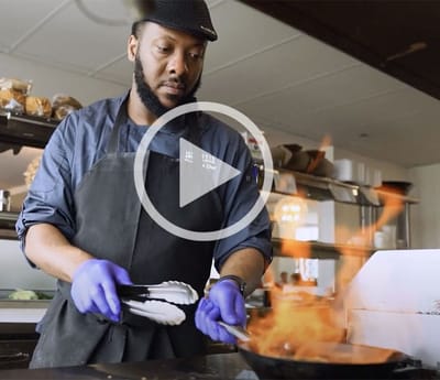Chef cooking in an open kitchen