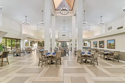 Bright dining room with tables and chairs