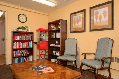 Interior view of a cozy common area with seating
