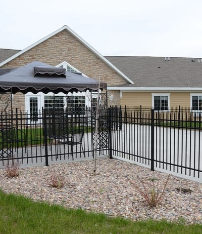 Outdoor space with a gazebo and fenced area