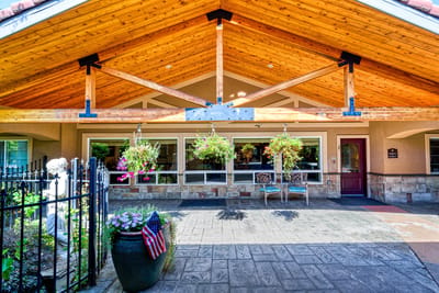 Exterior view of the facility entrance with wooden architecture