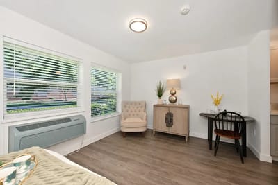 Cozy resident room with a chair and lamp