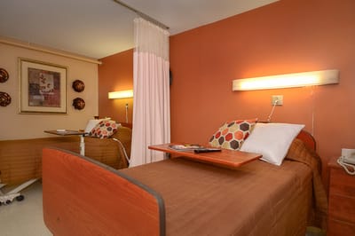 Cozy resident room with beds and decor