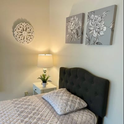 Cozy private bedroom with decor and lamp