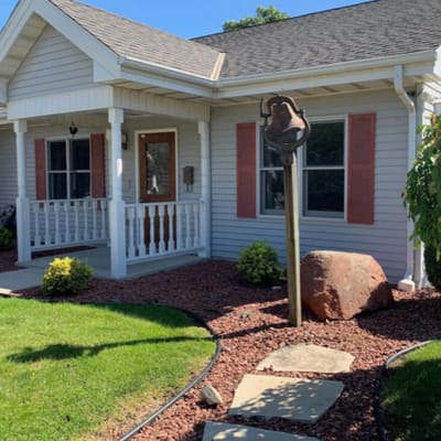 Exterior view of a home with landscaping