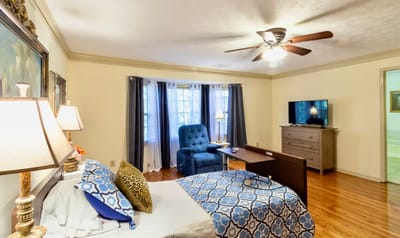 Cozy resident room with furniture and natural light