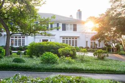 Exterior view of a senior living facility at sunset