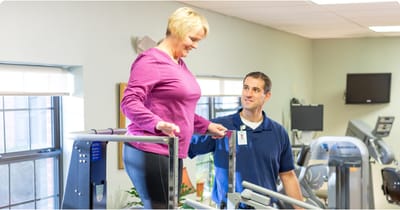Therapist assisting a resident during rehab