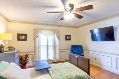 Cozy resident room with a bed and seating area