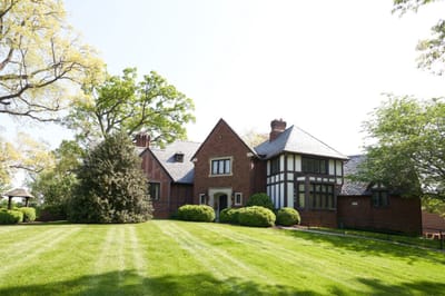 Exterior view of the facility with landscaped lawn