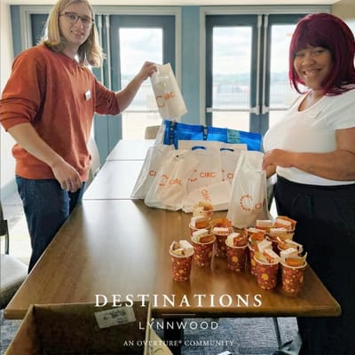 Staff preparing snacks in an activity room