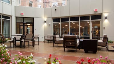 Outdoor seating area with flowers and seating