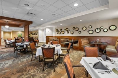Dining area with neatly set tables and decor