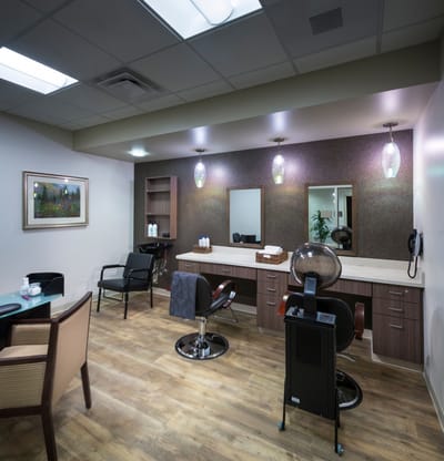 Interior view of a beauty salon with styling stations