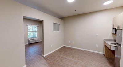 Interior view of a resident room with kitchenette