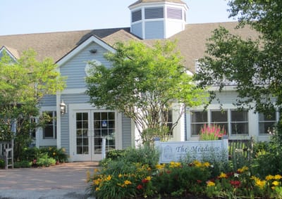 Exterior view of The Meadows at East Mountain with flowers