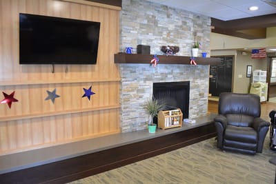 Cozy lounge area with a fireplace and decorations