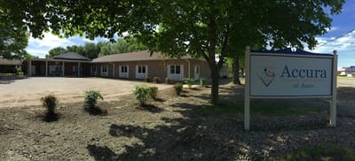 Exterior view of Accura Healthcare facility with sign