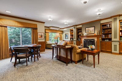 Cozy interior common area with seating and bookshelves