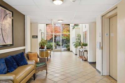 Bright hallway with seating and plants