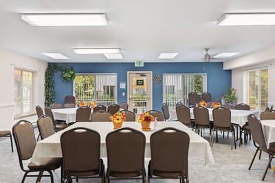 Dining room set up with tables and decorations