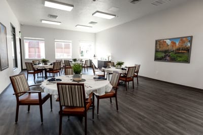 Bright dining room with tables set for meals