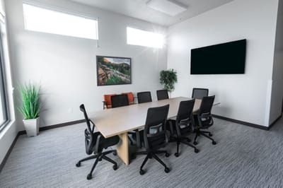Modern conference room with a large table and chairs