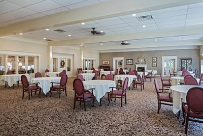 Interior dining room with tables and chairs set up