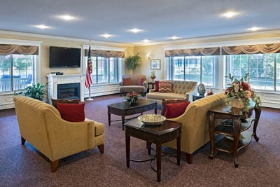 Cozy common area with comfortable seating and large windows